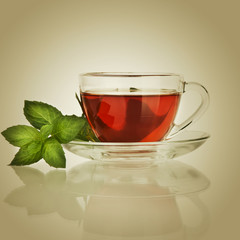 Cup of tea and mint leaf