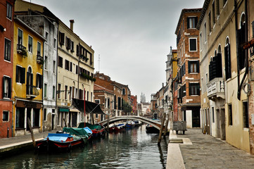 Fototapeta na wymiar Beautiful View of Canal with Boats in Venice