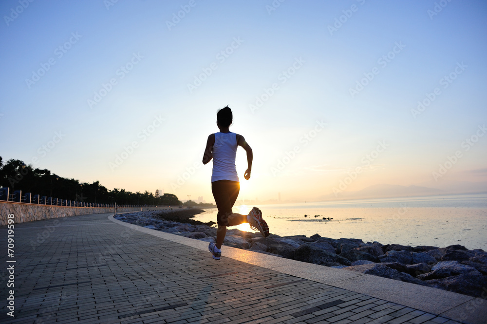 Poster woman runner athlete running at sunrise seaside