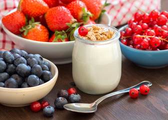 Jar of fresh yogurt, berries and muesli