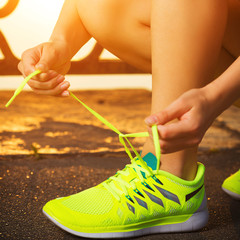 Running shoes. Barefoot running shoes closeup. Tying laces 