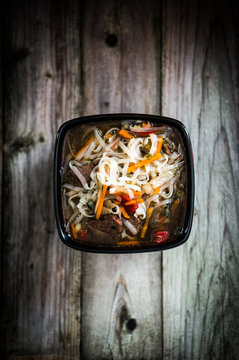 Pho soup on wooden background