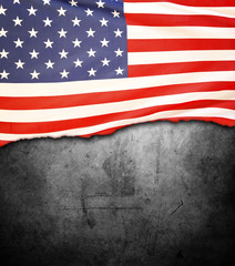 American flag on black concrete wall 
