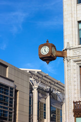 Fototapeta na wymiar Clock on the corner of historic building in Washington DC