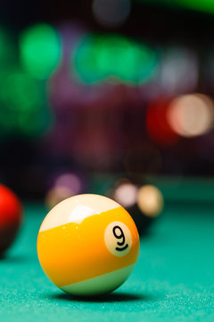 Billiard balls in a pool table.