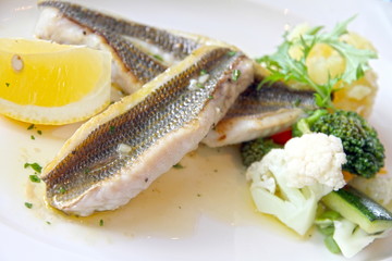Fresh haddock fillets in butter sauce on plate Denia Spain