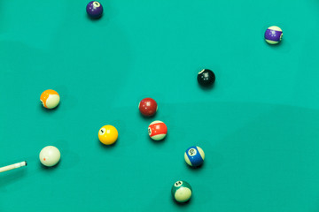 Breaking Pool Balls on green table