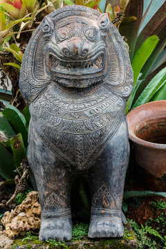 Stone statue of a lion-like creature in Thailand