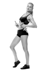 Fototapeta premium Sexy and fit woman lifting hand weights