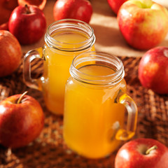 apple cider with focus on the top of both mason jars