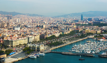 Fototapeta premium Aerial view of Barcelona with Port from helicopter