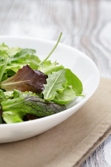 mesclun mix salad in white bowl