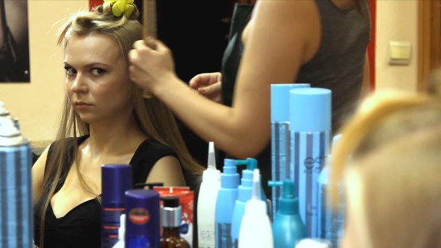 Woman with long hair at the beauty salon getting a blower