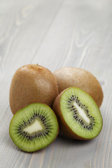 ripe kiwi fruit on wood table