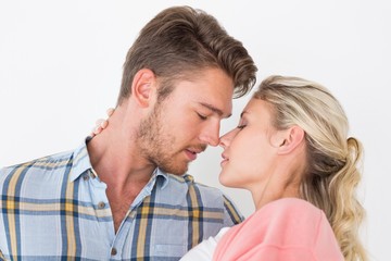 Romantic young couple about to kiss