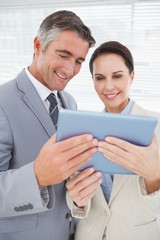 Business team using a tablet pc