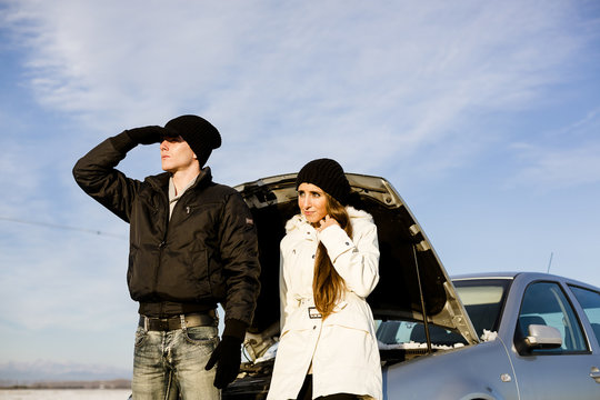 Desperate couple with Car Problem during a cold winter day