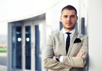 Fototapeta premium Portrait of an handsome businessman in an urban setting