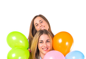 Naklejka premium Friends with balloons over white background