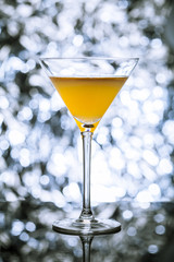 Cocktail glass with light bokeh