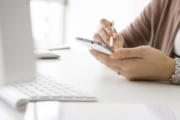 Hands of women that use the stylus pen