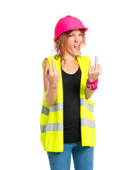 Worker woman making horn gesture over white background