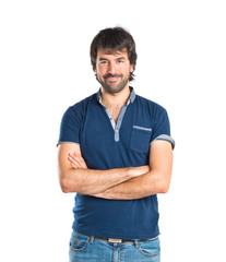 Fototapeta premium Man with his arms crossed over white background