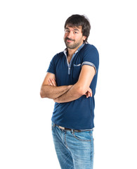 Fototapeta premium Man with his arms crossed over white background