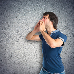 Man shouting over textured background