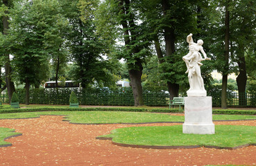 Fototapeta na wymiar Ancient sculpture in the Summer Gardens park in Saint-Petersburg