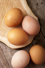 eggs close up on wooden background top view