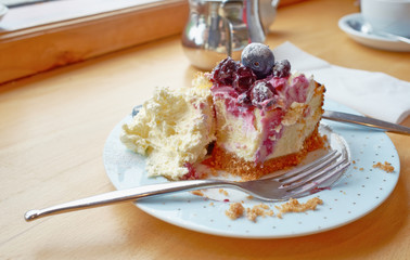A luxurious Blueberry Cheesecake with clotted cream.