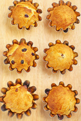 Baking cupcakes with raisins in baskets