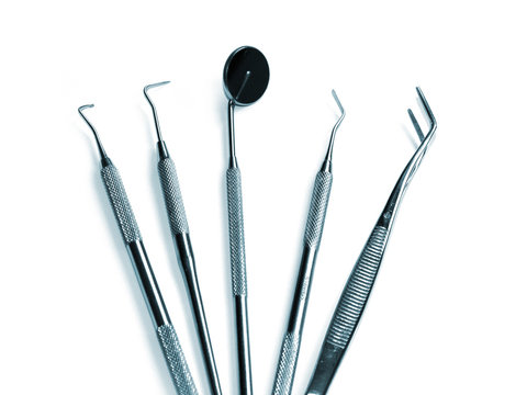 Dentist instruments on white background