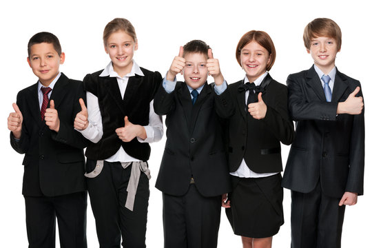 Five happy students hold his thumbs up