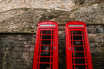 Obraz premium Two red british telephone booths