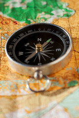 Compass laying on an orienteering map
