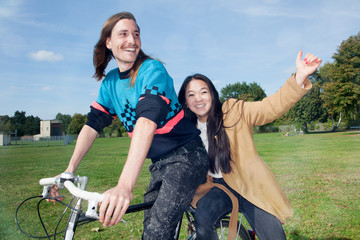 Man and woman on bicycle