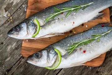 Two raw seabass with lime and rosemary