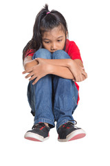Sad and depressed young Asian girl over white background