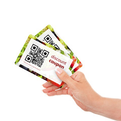 Fototapeta na wymiar hand holding two discount coupons with qr code isolated over wh