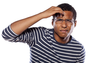unsure dark-skinned young man with glasses try to focus - obrazy, fototapety, plakaty