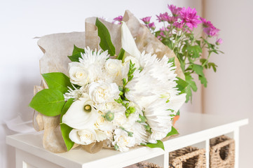 wedding bouquet of mainly white flowers