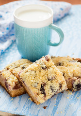 Fruit cake with streusel with cup of milk