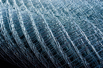 rolled supplies of shiny new chain link fence