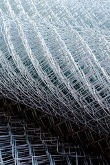 rolled supplies of shiny new chain link fence