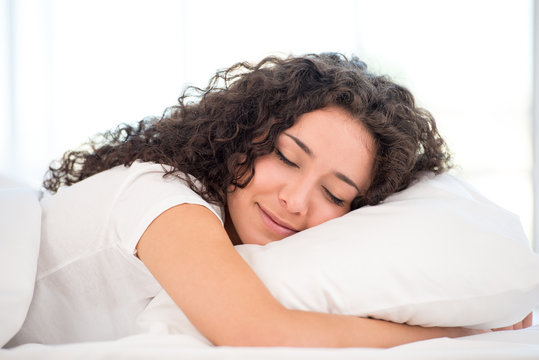 Close-up of sleeping happy woman