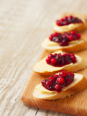 sandwiches of baguette, butter and lingonberry jam