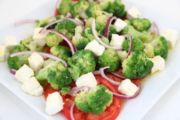 Broccoli salad with tomatoes and cheese