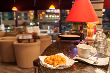 croissant and coffee cup at coffeeshop